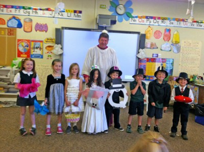 ST. BRENDAN kindergarteners recently celebrated the wedding of “Q” and “U.” Teacher Stacy Herman said the event reminds her students that the letters are always together. Members of the wedding party, from left, were Riley Houlihan, Catherine McDonough, Annie Wells, Jean Kwak, Henry Kaufman, Gabriel Hurley, Michael Hanna and Will Gilmore. Monsignor Terry Fleming officiated.