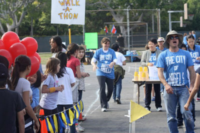 STUDENTS hoped to make it to the finish line iwthout spilling their water during the first leg of last year's Walk-a-Thon.