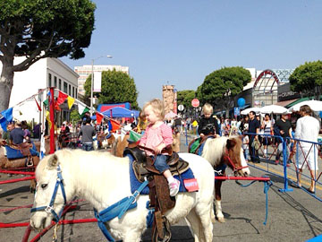 PONY RIDES, camels, water bubbles, food, games kept everyone busy at the Larchmont Family Fair on Oct. 27. 