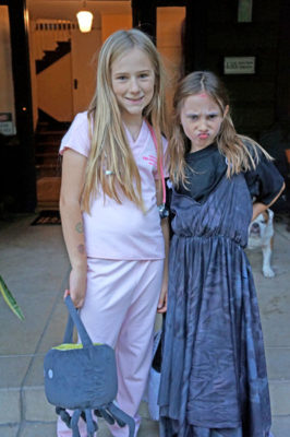 MARY HIGGINS dressed as a veterinarian, while her sister Sarah portrayed a zombie princess.