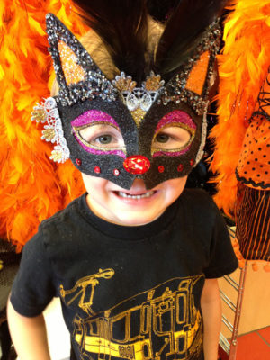 A FEATHERED MASK was donned by youngster Zachary Armbruster-Chi.
