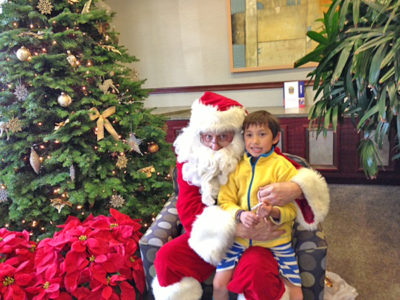 Santa hears Kyan Libbia's holiday wish list. He is the son of Marius and Saori Lobbia.