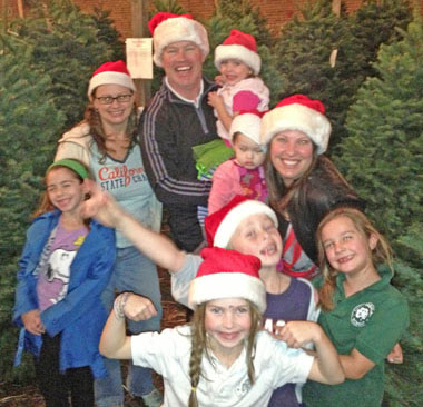 RESIDENTS SELECT trees last year: Neal McDonough holding London McDonough (2), Kim Schramm and her daughter Danielle, Ruvé McDonough holding Clover McDonough (1), Morgan McDonough and Kaya Smith and Catherine McDonough in the front.