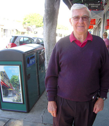 HEAD of the Larchmont business district Tom Kneafsey in front of the new bins.