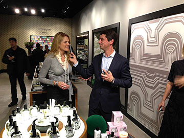 ISABEL MAYFIELD, Diptyque manager, receives aroma test from Gregory Daniel, regional sales manager, at Larchmont Blvd. opening. 