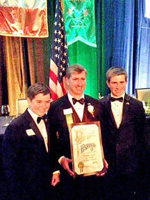 SEAN KNEAFSEY is surrounded by sons Dillon and Conor at recent Friendly Sons of St. Patrick dinner where he presided.