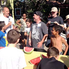 BROOKSIDE block party included ponies, a water slide, music and a barbecue. Here chairman Roy Forbes, left, judges the watermelon-eating contest.     Photo by Sandy Boeck 