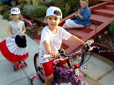 YOUNGSTERS took part in Lillian Way's Yankee Doodle Dandy decorated bike, soccer and wagon parade last year.