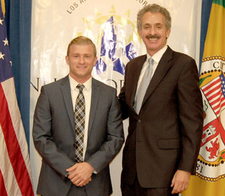 STEVE HOUCHIN with city at-torney Mike Feuer, who has increased the program to its “magic number” of 21 prosecutors.