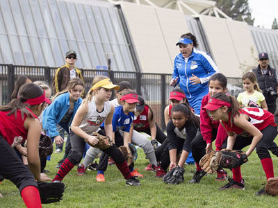 UCLA ASSISTANT COACH and three-time Olympic gold medal winner Lisa Fernandez shows Wishire Softball players how to get ready to field a ground ball.