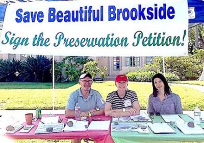 PROMOTING THE campaign for an Historic Preservation Overlay Zone in Brookside at the June block party were, from left, Taylor Louden, Jan Wieringa and Roxanne Steiny.