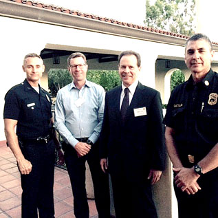 POLICE AND FIRE OFFICIALS at the Windsor Square Association meeting included LAPD Capt. Howard Leslie, Wilshire Division, left, and Mike Castillo, LAFD Battalion chief, District 11, right, shown with Gary Duff, board member, and Larry Guzin, WSA president.