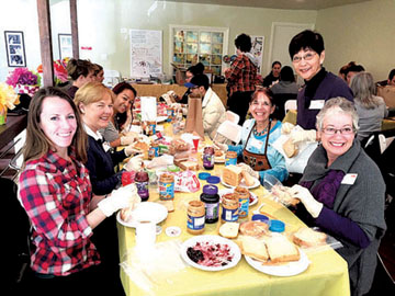 VOLUNTEERS at Big Sunday HQ made nearly 500 peanut butter and jelly sandwiches for homeless youth on March 3.