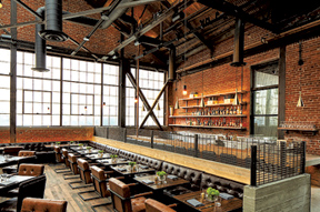 RECLAIMED wood, concrete and exposed steel preserve the industrial character for Officine Brera in the DTLA Arts District.