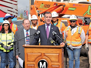 MAYOR GARCETTI and 5th District Councilman Paul Koretz join Metro officials and construction workers in front of a backdrop of museums at Wilshire and Fairfax.