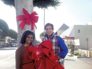 READYING for the season are Leisha Willis and Dr. Timothy Gogan of the Larchmont Boulevard Assoc.