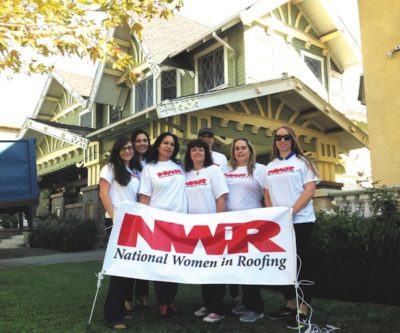 VOLUNTEERS from area chapter of National Women In Roofing stand in front of Alexandria House before their work begins. Left to right: Michelle Betancourt, Christi Bravo, Maria Alcala, Linda Foster, Carissa Santos, Careylyn Clifford and Camilla Adams.